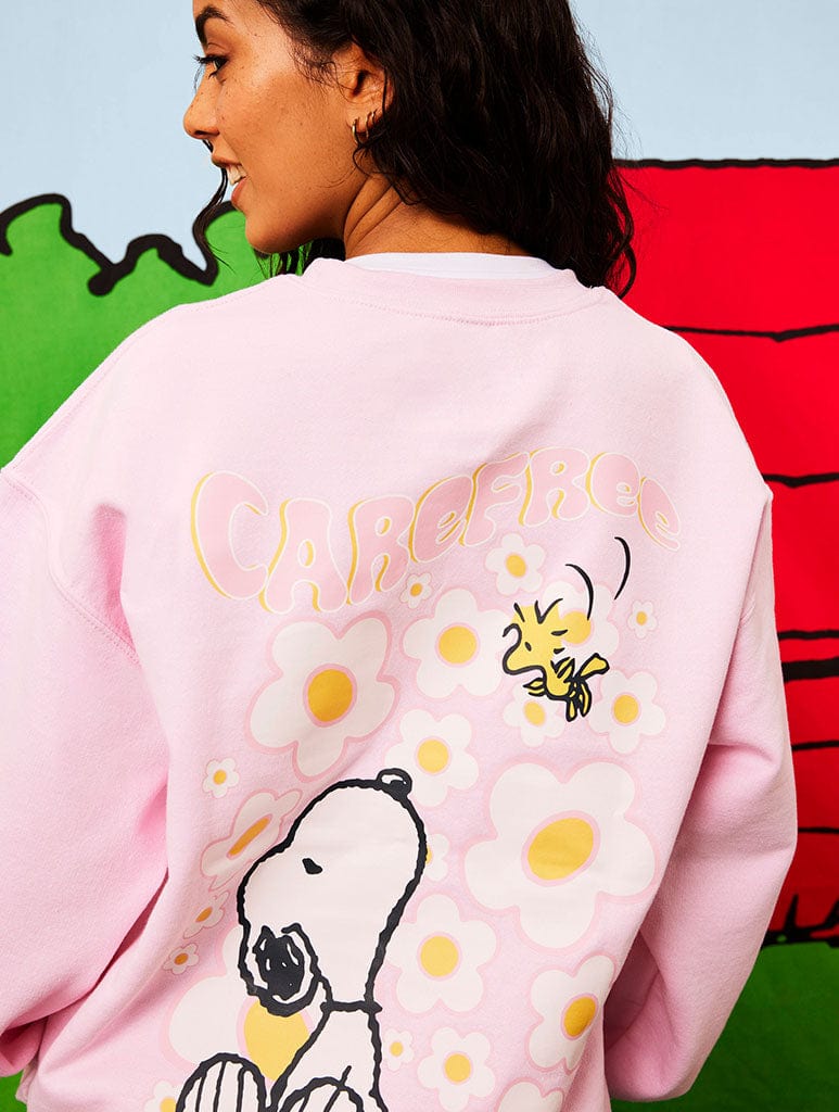 Peanuts x Skinnydip Snoopy Carefree Sweatshirt in Pink - Image 1